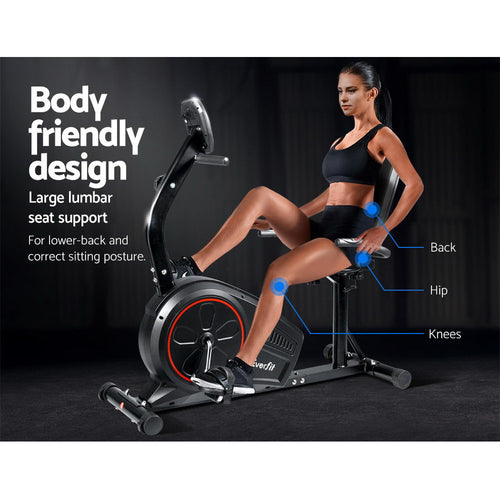 Person using the Recumbent Exercise Bike, showcasing its body-friendly design and large lumbar seat support.