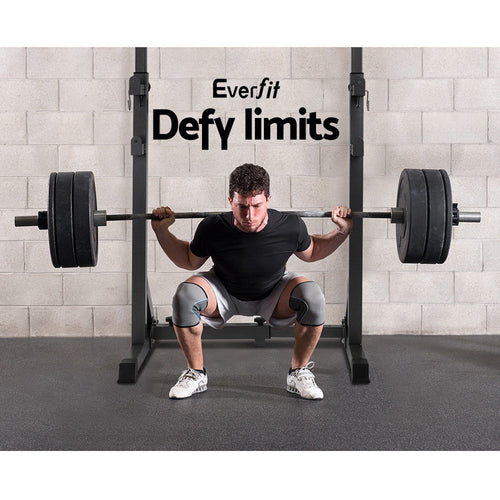 Man squatting with barbell on Everfit Weight Bench Adjustable Squat Rack, highlighting its 300kg capacity and sturdy design.