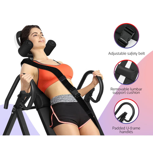 Person using Everfit Inversion Table Grey with safety belt, lumbar cushion, and padded handles for back pain relief.