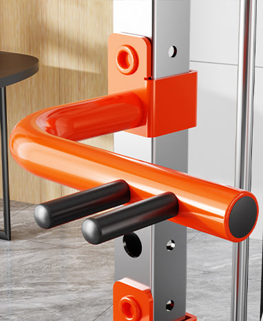 Close-up view of the handle on the Smith Machine M1 Max, showcasing its durable design and vibrant orange color.