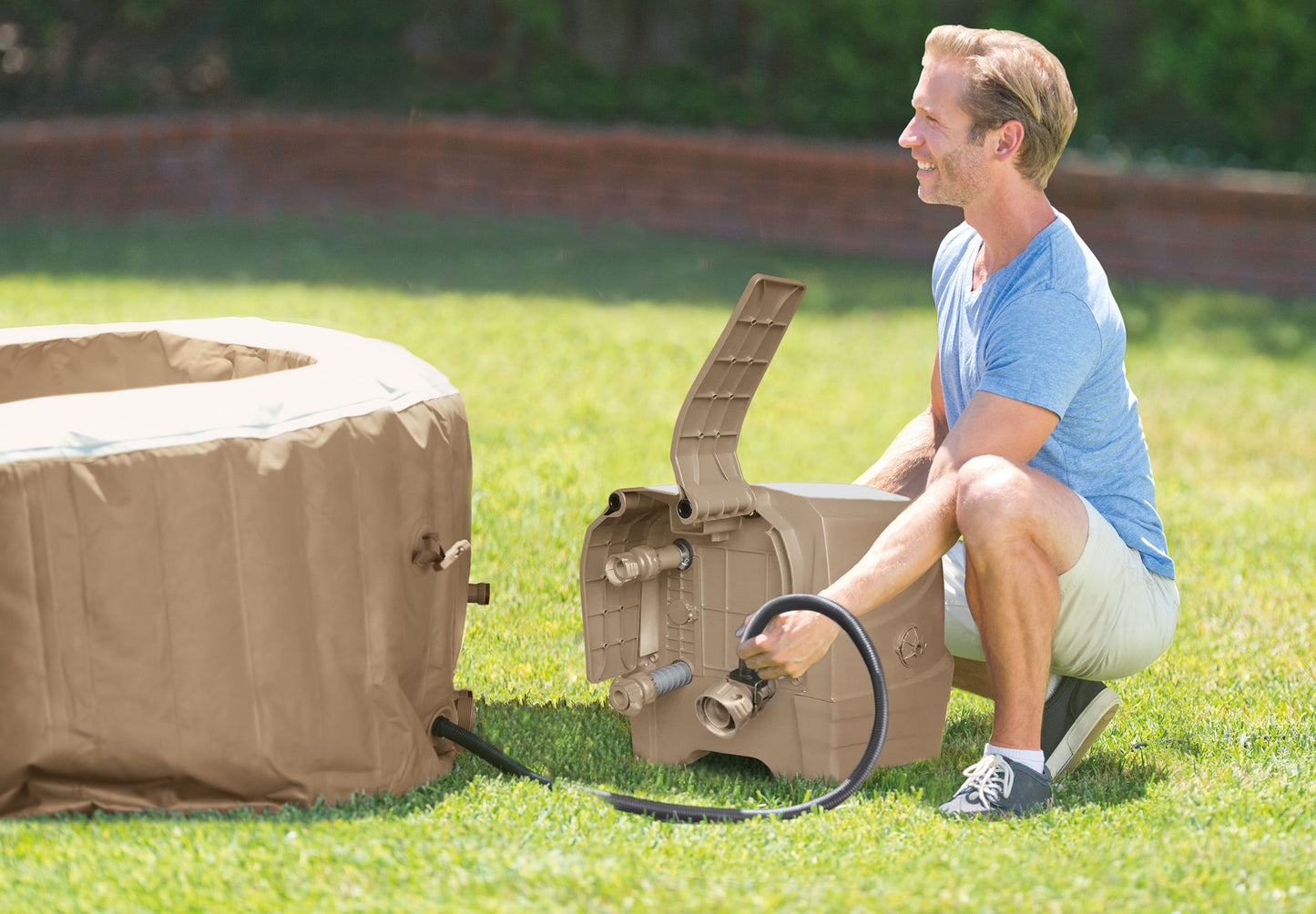 Man setting up an Inflatable Spa in the backyard for a relaxing bubble massage experience.