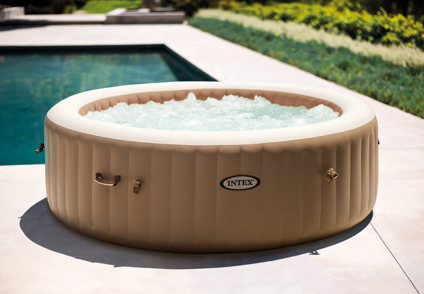 Inflatable Spa Bubble Massage 6 Person Hot Tub in a luxurious garden setting with bubbling water.
