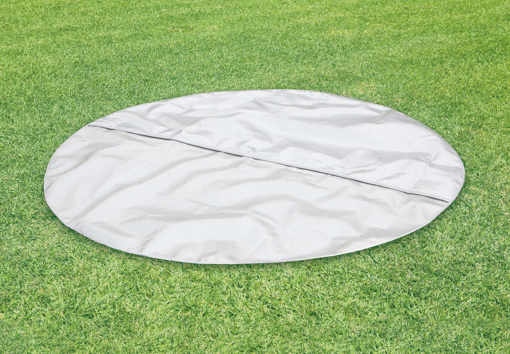 Inflatable Spa cover on green grass, perfect for protecting your Inflatable Spa from dirt and debris.