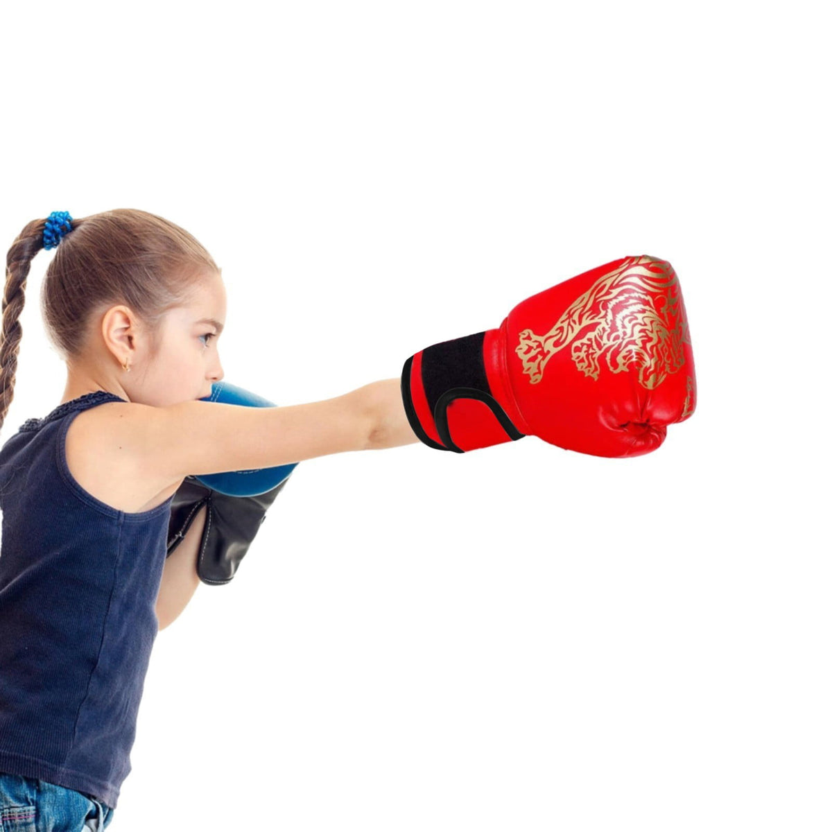Child wearing boxing gloves during sparring practice, showcasing Boxing Gloves for training and skill development.