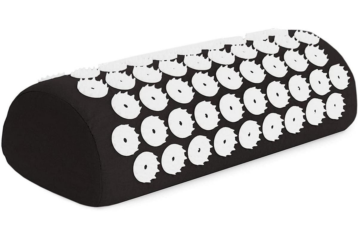 Acupressure mat and pillow set showing a black acupressure pillow with numerous pressure point spikes.