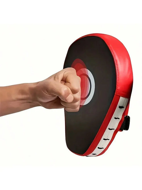 Boxing target training pad being struck with a fist, ideal for martial arts training and skill improvement.