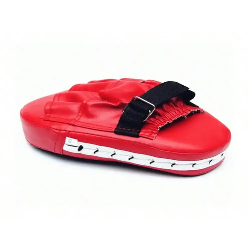 Boxing target training pad with red exterior designed for martial arts practice.
