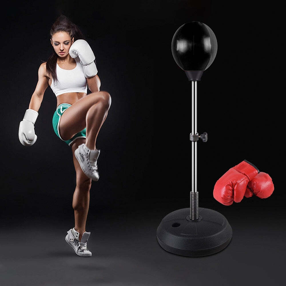Athlete training with Free Standing Boxing Set including punching ball and gloves for fitness workouts.