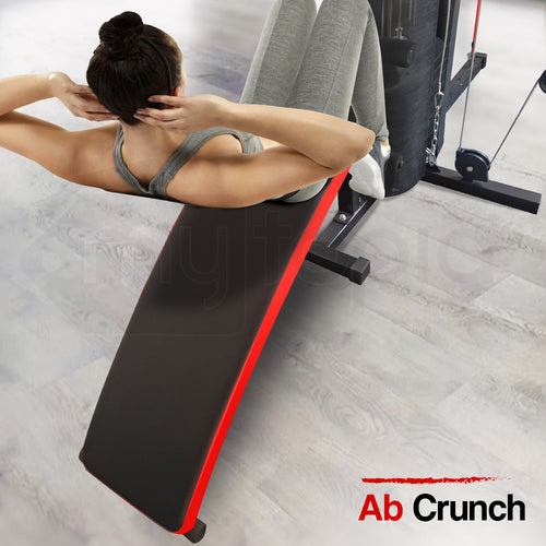 Home Gym user performing ab crunch on Proflex M9500 machine with fitness mat and equipment in a bright exercise space.
