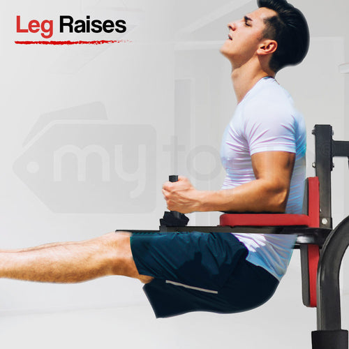 Man performing leg raises on a home gym machine, highlighting strength training and fitness exercises at home.