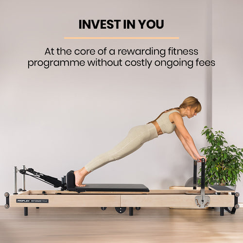 woman using Pilates Reformer PROFLEX for an effective at-home workout routine on a wooden stretch bed.
