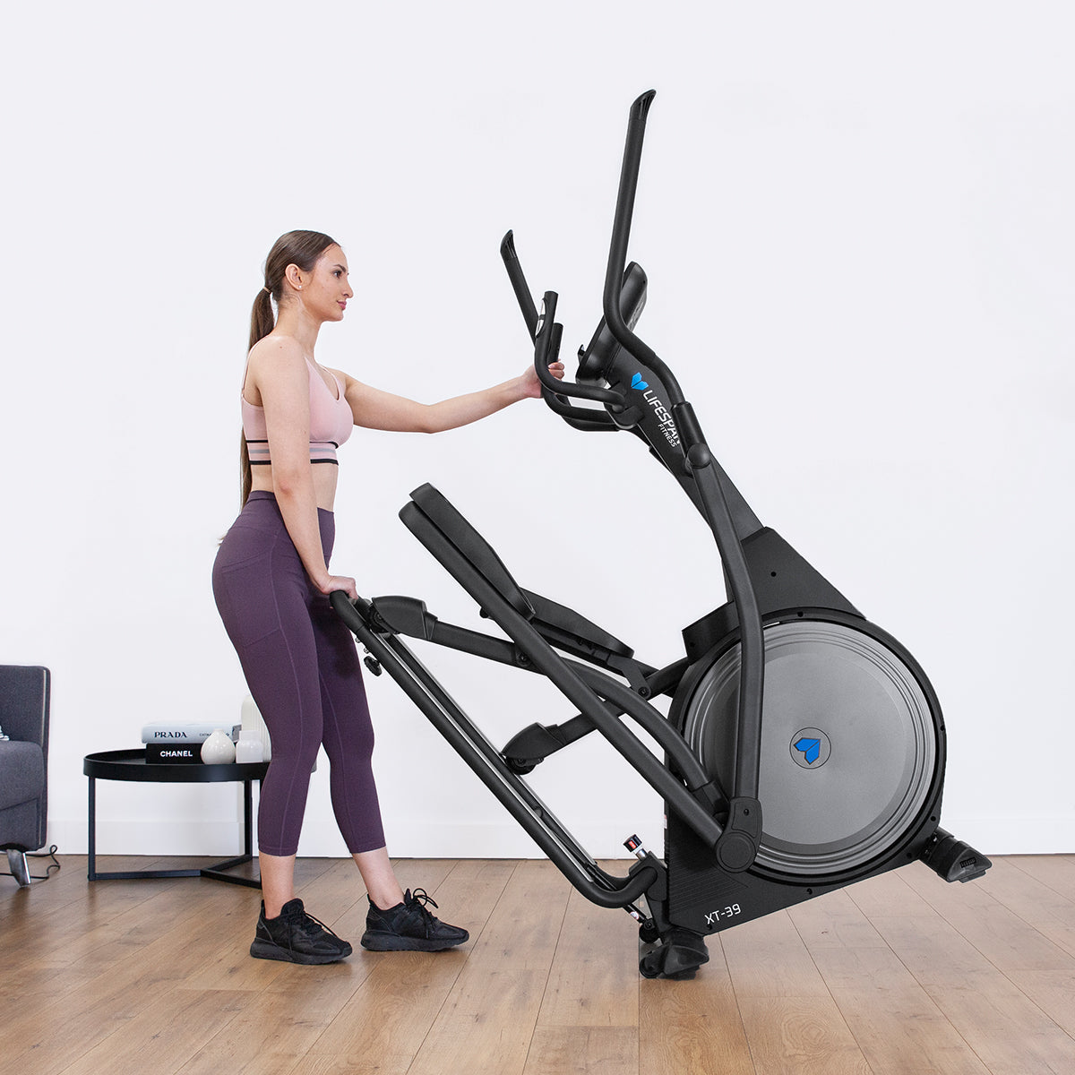 Woman using Lifespan Fitness XT-39 Cross Trainer in home gym setup