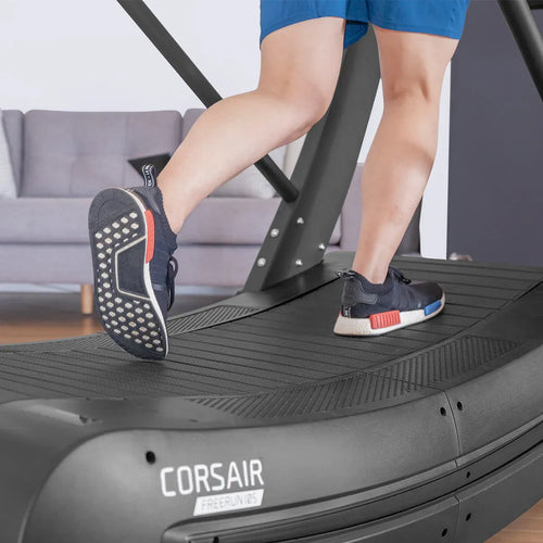 Person running on the Manual Treadmill, Lifespan Fitness Corsair FreeRun 105, showcasing athletic training.