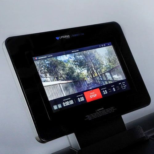 Close-up of the Lifespan Tempest CRX smart TFT screen on a Commercial Treadmill displaying workout stats.