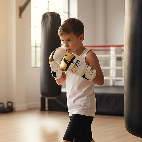 Young boy wearing Boxing Gloves while practicing in a gym, focusing on sparring and training.